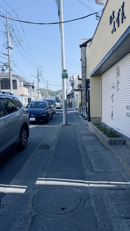 Residential street, evacuation sign barely discernible